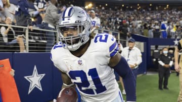 ARLINGTON, TEXAS - DECEMBER 26: Ezekiel Elliott #21 of the Dallas Cowboys jogs off the field during a game against the Washington Football Team at AT&T Stadium on December 26, 2021 in Arlington, Texas. The Cowboys defeated the Football Team 56-14. (Photo by Wesley Hitt/Getty Images)