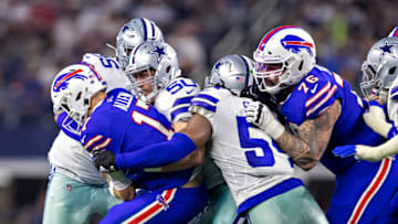ARLINGTON, TX - NOVEMBER 28: Josh Allen #17 of the Buffalo Bills is tackled by Sean Lee #50 of the Dallas Cowboys during the first half of a game on Thanksgiving Day at AT&T Stadium on November 28, 2019 in Arlington, Texas. The Bills defeated the Cowboys 26-15. (Photo by Wesley Hitt/Getty Images)