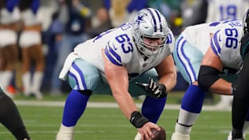 ARLINGTON, TEXAS - DECEMBER 24: Tyler Biadasz #63 of the Dallas Cowboys snaps the ball during the first half in the game against the Philadelphia Eagles at AT&T Stadium on December 24, 2022 in Arlington, Texas. (Photo by Sam Hodde/Getty Images)