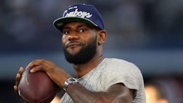 ARLINGTON, TX - SEPTEMBER 08: NBA player Lebron James of the Miami Heat throws a football at AT&T Stadium before a Sunday night game between the New York Giants and the Dallas Cowboys on September 8, 2013 in Arlington, Texas. (Photo by Ronald Martinez/Getty Images)