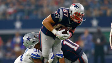 ARLINGTON, TX - OCTOBER 11: Rob Gronkowski #87 of the New England Patriots tries to break away from Byron Jones #31 of the Dallas Cowboys during the second half of the NFL game against the New England Patriots at AT&T Stadium on October 11, 2015 in Arlington, Texas. (Photo by Mike Stone/Getty Images)