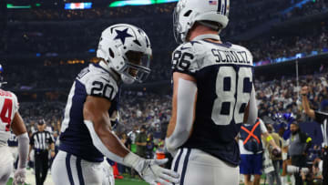 ARLINGTON, TEXAS - NOVEMBER 24: Dalton Schultz #86 of the Dallas Cowboys celebrates a touchdown with Tony Pollard #20 during the second half in the game against the New York Giants at AT&T Stadium on November 24, 2022 in Arlington, Texas. (Photo by Richard Rodriguez/Getty Images)