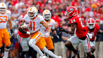 ATHENS, GEORGIA - NOVEMBER 05: Jalin Hyatt #11 of the Tennessee Volunteers carries the ball past Malaki Starks #24 of the Georgia Bulldogs at Sanford Stadium on November 05, 2022 in Athens, Georgia. (Photo by Todd Kirkland/Getty Images)