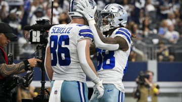 Oct 2, 2022; Arlington, Texas, USA; Dallas Cowboys tight end Dalton Schultz (86) and wide receiver CeeDee Lamb (88) celebrates a touchdown against the Washington Commanders during the second half at AT&T Stadium. Mandatory Credit: Jerome Miron-USA TODAY Sports