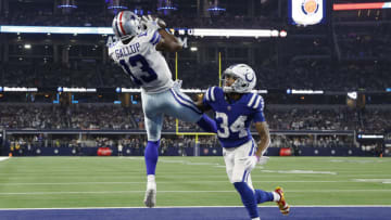 Dec 4, 2022; Arlington, Texas, USA; Dallas Cowboys wide receiver Michael Gallup (13) catches a touchdown pass against Indianapolis Colts cornerback Isaiah Rodgers (34) in the fourth quarter at AT&T Stadium. Mandatory Credit: Tim Heitman-USA TODAY Sports