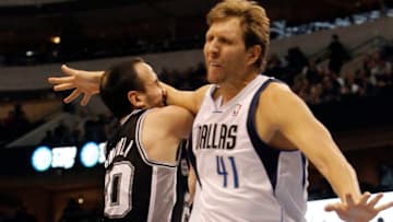 Dallas Mavericks forward Dirk Nowitzki (41) fouls San Antonio Spurs guard Manu Ginobili (20) during the second half of a basketball game at American Airlines Center in Dallas, Texas, Sunday, December 30, 2012. Spurs won, 111-86. (Brandon Wade/Fort Worth Star-Telegram/MCT via Getty Images)