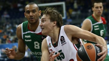 BERLIN, GERMANY. MAY 15, 2016. Lokomotiv Kuban Krasnodar's Ryan Broekhoff (front) dribbles past and Laboral Kutxa's Adam Hanga (L) in their 2015/16 Season Basketball Euroleague Final Four third place match at Mercedes-Benz Arena. Stanislav Krasilnikov/TASS (Photo by Stanislav KrasilnikovTASS via Getty Images)