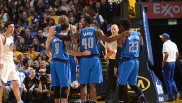 OAKLAND, CA - DECEMBER 30: Deron Williams #8, Harrison Barnes #40 and Wesley Matthews #23 of the Dallas Mavericks huddle up during the game against the Golden State Warriors on December 30, 2016 at ORACLE Arena in Oakland, California. NOTE TO USER: User expressly acknowledges and agrees that, by downloading and or using this photograph, user is consenting to the terms and conditions of Getty Images License Agreement. Mandatory Copyright Notice: Copyright 2016 NBAE (Photo by Noah Graham/NBAE via Getty Images)