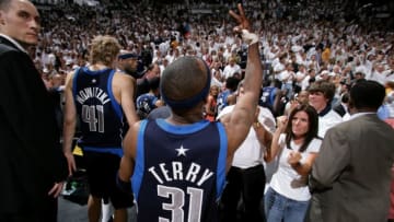 MIAMI - JUNE 18: Jason Terry #31 of the Dallas Mavericks gestures as he and teammate Dirk Nowitzki #41 walk off the court after their 101-100 loss to the Miami Heat during Game Five of the 2006 NBA Finals June 18, 2006 at American Airlines Arena in Miami, Florida. NOTE TO USER: User expressly acknowledges and agrees that, by downloading and or using this photograph, User is consenting to the terms and conditions of the Getty Images License Agreement. Mandatory Copyright Notice: Copyright 2006 NBAE (Photo by Jesse D. Garrabrant/NBAE via Getty Images)