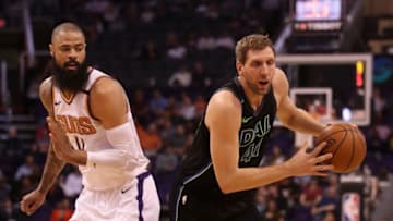 PHOENIX, AZ - JANUARY 31: Dirk Nowitzki #41 of the Dallas Mavericks drives the ball past Tyson Chandler #4 of the Phoenix Suns during the first half of the NBA game at Talking Stick Resort Arena on January 31, 2018 in Phoenix, Arizona. NOTE TO USER: User expressly acknowledges and agrees that, by downloading and or using this photograph, User is consenting to the terms and conditions of the Getty Images License Agreement. (Photo by Christian Petersen/Getty Images)