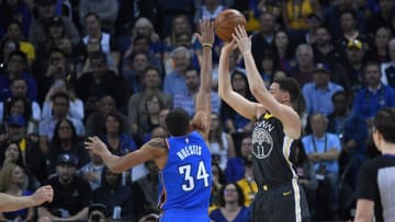 OAKLAND, CA - FEBRUARY 06: Klay Thompson #11 of the Golden State Warriors shoots over Josh Huestis #34 of the Oklahoma City Thunder during the first half of their NBA basketball game at ORACLE Arena on February 6, 2018 in Oakland, California. NOTE TO USER: User expressly acknowledges and agrees that, by downloading and or using this photograph, User is consenting to the terms and conditions of the Getty Images License Agreement. (Photo by Thearon W. Henderson/Getty Images)