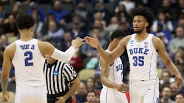 PITTSBURGH, PA - MARCH 15: Marvin Bagley III #35 of the Duke Blue Devils celebrates with teammate Gary Trent Jr. #2 after hitting a three pointer against the Iona Gaels during the first half of the game in the first round of the 2018 NCAA Men's Basketball Tournament at PPG PAINTS Arena on March 15, 2018 in Pittsburgh, Pennsylvania. (Photo by Rob Carr/Getty Images)