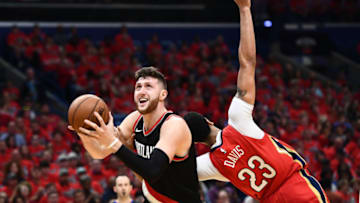 NEW ORLEANS, LA - APRIL 21: Jusuf Nurkic #27 of the Portland Trail Blazers is defended by Anthony Davis #23 of the New Orleans Pelicans during Game Four of the first round of the Western Conference playoffs at the Smoothie King Center on April 21, 2018 in New Orleans, Louisiana. The Pelicans defeated the Trail Blazers 131-123 to sweep the series 4-0. NOTE TO USER: User expressly acknowledges and agrees that, by downloading and or using this photograph, User is consenting to the terms and conditions of the Getty Images License Agreement. (Photo by Stacy Revere/Getty Images)