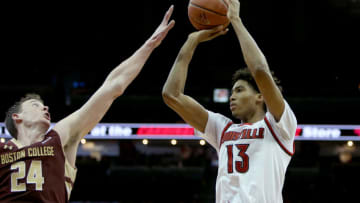 LOUISVILLE, KY - FEBRUARY 6: Raymond Spalding #13 of the Louisville Cardinals attempts a shot over Dennis Clifford #24 of the Boston College Eagles during the second half at KFC Yum! Center on February 6, 2016 in Louisville, Kentucky. (Photo by Dylan Buell/Getty Images)