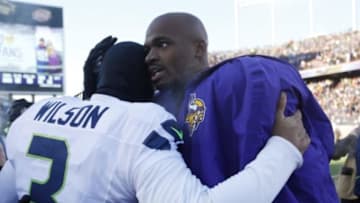 Jan 10, 2016; Minneapolis, MN, USA; Minnesota Vikings running back Adrian Peterson (right) greets Seattle Seahawks quarterback Russell Wilson (3) after a NFC Wild Card playoff football game at TCF Bank Stadium. Mandatory Credit: Bruce Kluckhohn-USA TODAY Sports