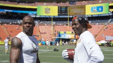 January 31, 2016; Honolulu, HI, USA; Team Rice running back Adrian Peterson of the Minnesota Vikings (28, left) and Team Irvin quarterback Teddy Bridgewater of the Minnesota Vikings (5, right) talk before the 2016 Pro Bowl game at Aloha Stadium. Mandatory Credit: Kyle Terada-USA TODAY Sports