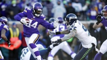 Jan 10, 2016; Minneapolis, MN, USA; Minnesota Vikings wide receiver Cordarrelle Patterson (84) returns the opening kick against Seattle Seahawks defensive end Cassius Marsh (91) in a NFC Wild Card playoff football game at TCF Bank Stadium. Mandatory Credit: Bruce Kluckhohn-USA TODAY Sports