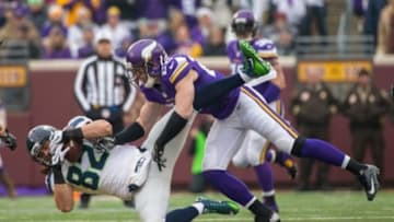 Dec 6, 2015; Minneapolis, MN, USA; Minnesota Vikings safety Harrison Smith (22) tackles Seattle Seahawks tight end Luke Willson (82) during the first quarter at TCF Bank Stadium. Mandatory Credit: Brace Hemmelgarn-USA TODAY Sports
