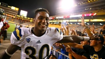 Sep 25, 2014; Tempe, AZ, USA; UCLA Bruins linebacker Myles Jack (30) celebrates with fans following the game against the Arizona State Sun Devils at Sun Devil Stadium. UCLA defeated Arizona State 62-27. Mandatory Credit: Mark J. Rebilas-USA TODAY Sports