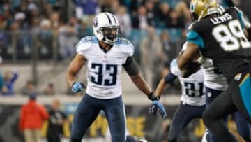 Dec 18, 2014; Jacksonville, FL, USA; Tennessee Titans free safety Michael Griffin (33) rushes against the Jacksonville Jaguars during the second half at EverBank Field. Jacksonville Jaguars defeated the Tennessee Titans 21-13. Mandatory Credit: Kim Klement-USA TODAY Sports