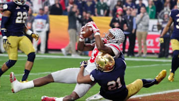 Jan 1, 2016; Glendale, AZ, USA; Ohio State Buckeyes wide receiver Michael Thomas (3) scores a 15 yard touchdown as Notre Dame Fighting Irish cornerback Nick Watkins (21) defends during the first half in the 2016 Fiesta Bowl at University of Phoenix Stadium. Mandatory Credit: Matt Kartozian-USA TODAY Sports