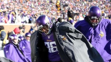 Jan 10, 2016; Minneapolis, MN, USA; Minnesota Vikings strong safety Robert Blanton (36) wears a coat as he walks along the bench in the first half of a NFC Wild Card playoff football game against the Seattle Seahawks at TCF Bank Stadium. Mandatory Credit: Brace Hemmelgarn-USA TODAY Sports