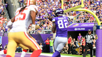 MINNEAPOLIS, MN - SEPTEMBER 09: Minnesota Vikings Tight End Kyle Rudolph (82) catches a touchdown pass from Minnesota Vikings Quarterback Kirk Cousins (8) during an NFL game between the Minnesota Vikings and the San Francisco 49ers on September 9, 2018 at U.S. Bank Stadium in Minneapolis, Minnesota. The Vikings defeated the 49ers 24-16.(Photo by Nick Wosika/Icon Sportswire via Getty Images)