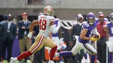 MINNEAPOLIS, MN - SEPTEMBER 09: Adam Thielen #19 of the Minnesota Vikings carries the ball after a reception against Fred Warner #48 of the San Francisco 49ers during the game on September 9, 2018 at U.S. Bank Stadium in Minneapolis, Minnesota. The Vikings defeated the 49ers 24-16. (Photo by Hannah Foslien/Getty Images)