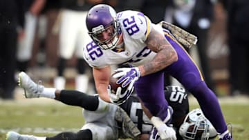 Minnesota Vikings tight end Kyle Rudolph (82) picked up a first down as he was tackled by Oakland Raiders cornerback D.J. Hayden (25) at the Oakland Coliseum Sunday November 15, 2015 in Oakland, CA. ] The Minnesota Vikings beat at the Oakland Raiders 30-14 in the Coliseum. Jerry Holt/ Jerry.Holt@Startribune.com (Photo By Jerry Holt/Star Tribune via Getty Images)