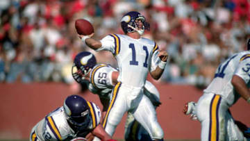SAN FRANCISCO, CA - OCTOBER 30: Wade Wilson #11 of the Minnesota Vikings drops back to pass against the San Francisco 49ers during an NFL Football game October 30, 1988 at Candlestick Park in San Francisco, California. Wilson played for the Vikings from 1981-91. (Photo by Focus on Sport/Getty Images)