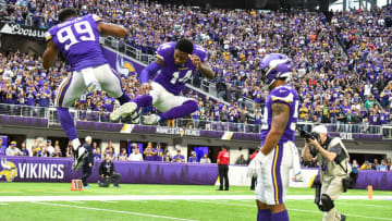 MINNEAPOLIS, MN - OCTOBER 13: Minnesota Vikings Defensive End Danielle Hunter (99) and Minnesota Vikings Wide Receiver Stefon Diggs (14) greet each other with flying kicks before a game between the Philadelphia Eagles and Minnesota Vikings on October 13, 2019 at U.S. Bank Stadium in Minneapolis, MN.(Photo by Nick Wosika/Icon Sportswire via Getty Images)
