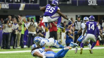 MINNEAPOLIS, MN - DECEMBER 08: Alexander Mattison #25 of the Minnesota Vikings leaps over two Detroit Lions defenders while running with the ball in the second quarter of the game at U.S. Bank Stadium on December 8, 2019 in Minneapolis, Minnesota. (Photo by Stephen Maturen/Getty Images)