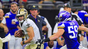 NEW ORLEANS, LA - AUGUST 09: New Orleans Saints quarterback Taysom Hill (7) runs against Minnesota Vikings inside linebacker Cameron Smith (59) during the second half of an NFL preseason game between the New Orleans Saints and the Minnesota Vikings on August 9, 2019 at the Mercedes-Benz Superdome in New Orleans, LA. (Photo by Stephen Lew)