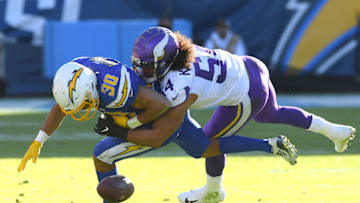 CARSON, CA - DECEMBER 15: Middle linebacker Eric Kendricks #54 of the Minnesota Vikings forces a fumble by running back Austin Ekeler #30 of the Los Angeles Chargers allowing defensive end Ifeadi Odenigbo #95 of the Minnesota Vikings to grab the ball and run for a touchdown in the second quarter of the game at Dignity Health Sports Park on December 15, 2019 in Carson, California. (Photo by Jayne Kamin-Oncea/Getty Images)