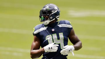 MIAMI GARDENS, FLORIDA - OCTOBER 04: DK Metcalf #14 of the Seattle Seahawks looks on against the Miami Dolphins during the second half at Hard Rock Stadium on October 04, 2020 in Miami Gardens, Florida. (Photo by Michael Reaves/Getty Images)