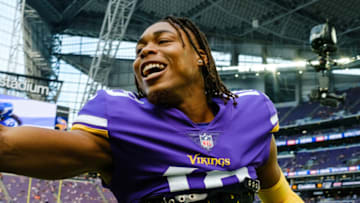 MINNEAPOLIS, MN - OCTOBER 03: Justin Jefferson #18 of the Minnesota Vikings greets people before the game against the Cleveland Browns at U.S. Bank Stadium on October 3, 2021 in Minneapolis, Minnesota. (Photo by Stephen Maturen/Getty Images)