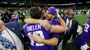 NEW ORLEANS, LOUISIANA - JANUARY 05: Kirk Cousins #8 of the Minnesota Vikings celebrates with Adam Thielen #19 after defeating the New Orleans Saints 26-20 during overtime in the NFC Wild Card Playoff game at Mercedes Benz Superdome on January 05, 2020 in New Orleans, Louisiana. (Photo by Chris Graythen/Getty Images)