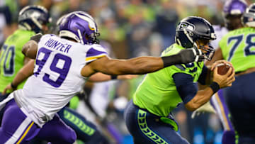 Dec 2, 2019; Seattle, WA, USA; Minnesota Vikings defensive end Danielle Hunter (99) sacks Seattle Seahawks quarterback Russell Wilson (3) during the first half at CenturyLink Field. Mandatory Credit: Steven Bisig-USA TODAY Sports