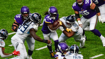 Sep 27, 2020; Minneapolis, Minnesota, USA; Minnesota Vikings running back Dalvin Cook (33) is tackled by linebacker Jadeveon Clowney (99) and defensive end DaQuan Jones (90) during the second quarter at U.S. Bank Stadium. Mandatory Credit: Jeffrey Becker-USA TODAY Sports