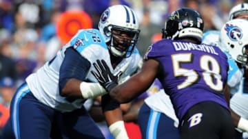 Nov 9, 2014; Baltimore, MD, USA; Tennessee Titans offensive tackle Michael Oher (72) blocks Baltimore Ravens linebacker Elvis Dumervil (58) in the first quarter at M&T Bank Stadium. The Ravens won 21-7. Mandatory Credit: Evan Habeeb-USA TODAY Sports