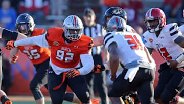 Jan 30, 2016; Mobile, AL, USA; North squad defensive tackle Adolphus Washington of Ohio State (92) pursues South squad running back DeAndre Washington of Texas Tech (31) in the second half of the Senior Bowl at Ladd-Peebles Stadium. Mandatory Credit: Chuck Cook-USA TODAY Sports