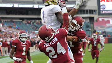 Oct 11, 2014; Philadelphia, PA, USA; Temple Owls Jarred Alwan (41) and Jihaad Pretlow (24) break up a hail marry attempt for Tulsa Golden Hurricane wide receiver Keyarris Garrett (1) and Keevan Lucas (2) late in the fourth quarter at Lincoln Financial Field. The Owls won 35-24. Mandatory Credit: Derik Hamilton-USA TODAY Sports
