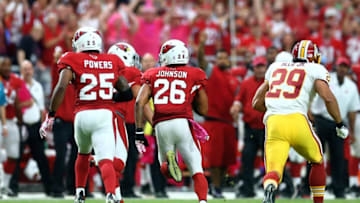 Oct 12, 2014; Glendale, AZ, USA; Arizona Cardinals safety Rashad Johnson (26) returns an interception in the fourth quarter against the Washington Redskins at University of Phoenix Stadium. The Cardinals defeated the Redskins 30-20. Mandatory Credit: Mark J. Rebilas-USA TODAY Sports