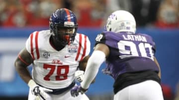 Dec 31, 2014; Atlanta , GA, USA; Mississippi Rebels offensive lineman Laremy Tunsil (78) prepares to block TCU Horned Frogs defensive tackle Terrell Lathan (90) during the first quarter in the 2014 Peach Bowl at the Georgia Dome. Mandatory Credit: Brett Davis-USA TODAY Sports