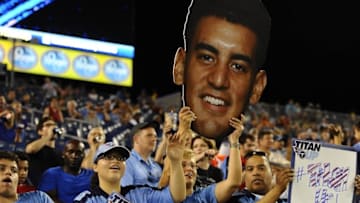 Sep 3, 2015; Nashville, TN, USA; Fans hold up a cut out of Tennessee Titans quarterback Marcus Mariota (8) during the second half against the Minnesota Vikings at Nissan Stadium. The Titans won 24-17. Mandatory Credit: Christopher Hanewinckel-USA TODAY Sports