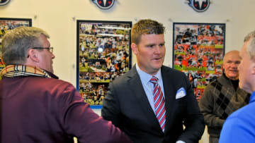Jan 18, 2016; Nashville, Tennessee, USA; Tennessee Titans new general manager Jon Robinson (center) talks with media following a press conference at Saint Thomas Sports Park. Mandatory Credit: Jim Brown-USA TODAY Sports