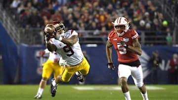 Dec 30, 2015; San Diego, CA, USA; Southern California Trojans wide receiver JuJu Smith-Schuster (9) attempts to catch a pass while defended by Wisconsin Badgers cornerback Darius Hillary (5) during the 2015 Holiday Bowl at Qualcomm Stadium. Mandatory Credit: Kirby Lee-USA TODAY Sports