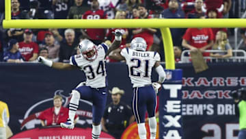 Dec 13, 2015; Houston, TX, USA; New England Patriots cornerback Leonard Johnson (34) and cornerback Malcolm Butler (21) celebrate after a defensive play during the second half against the Houston Texans at NRG Stadium. The Patriots defeated the Texans 27-6. Mandatory Credit: Troy Taormina-USA TODAY Sports