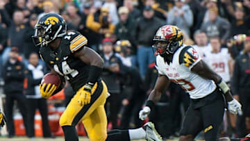 Oct 31, 2015; Iowa City, IA, USA; Iowa Hawkeyes defensive back Desmond King (14) returns an interception 88 yards for a touchdown during the second half against the Maryland Terrapins at Kinnick Stadium. Iowa won 31-15. Mandatory Credit: Jeffrey Becker-USA TODAY Sports