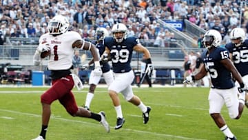 Sep 20, 2014; University Park, PA, USA; Massachusetts Minutemen wide receiver Tajae Sharpe (1) runs with the ball during the fourth quarter against the Penn State Nittany Lions at Beaver Stadium. Penn State defeated Massachusetts 48-7. Mandatory Credit: Matthew O